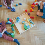 Grünes Temperament im Grimm’s Baukasten: Runde Holzbausteine für ruhiges, harmonisches Spielen